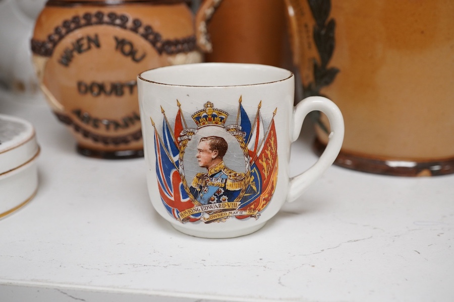 A Royal Doulton Queen Victoria commemorative jug and ten other pottery items to include a silver mounted beaker, 20cm high. Condition - mostly fair/good